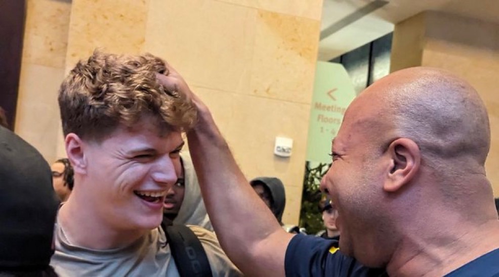 Coach Acosta laughing with recruit